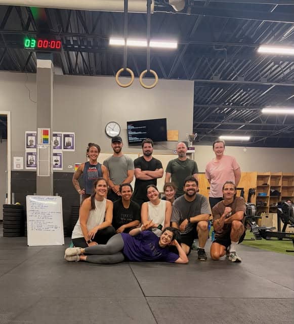 Members of Bar None Fitness Studio gathered together on the training floor
